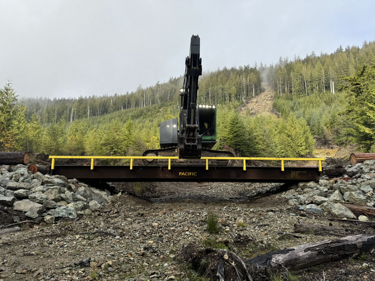 Heavy machinery on bridge over rocks