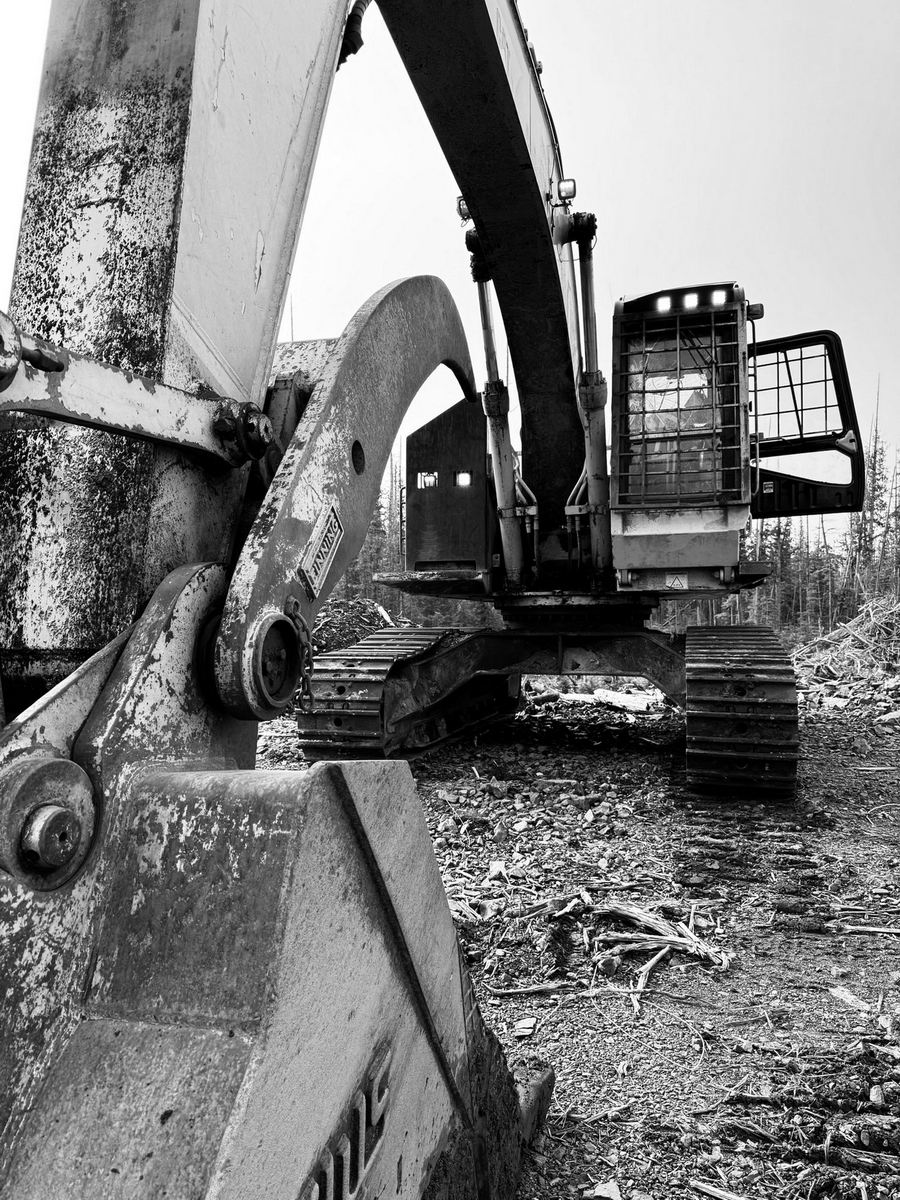 coast-roads-constrution-equipment-09 Excavator in a deforested area.