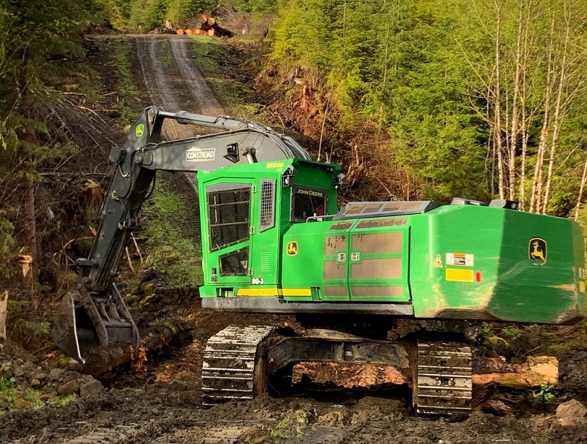 Road Maintenance Green machinery clearing forest road