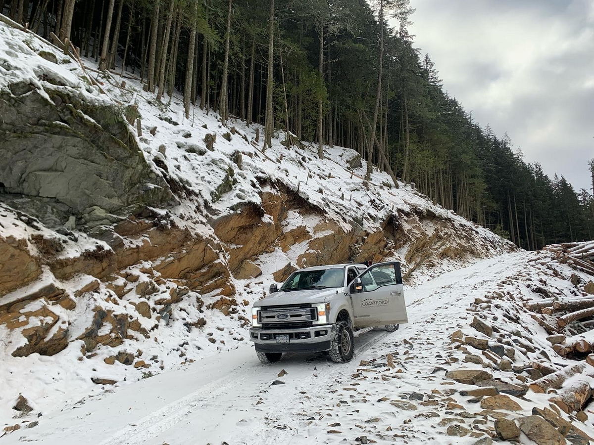 Timber sale roads Truck on snowy forest road