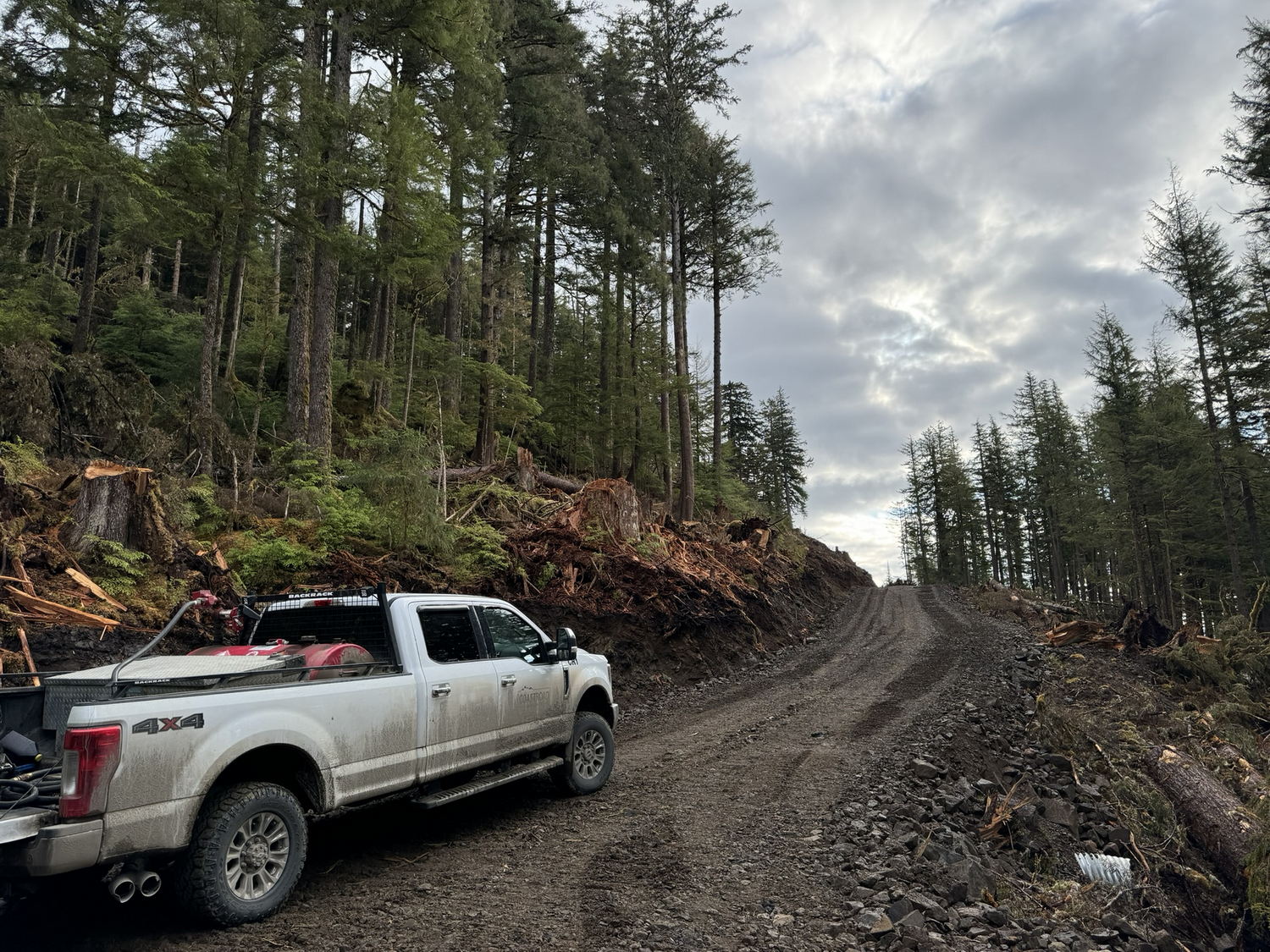 coast-roads-constrution-equipment-14 Truck on a muddy forest road