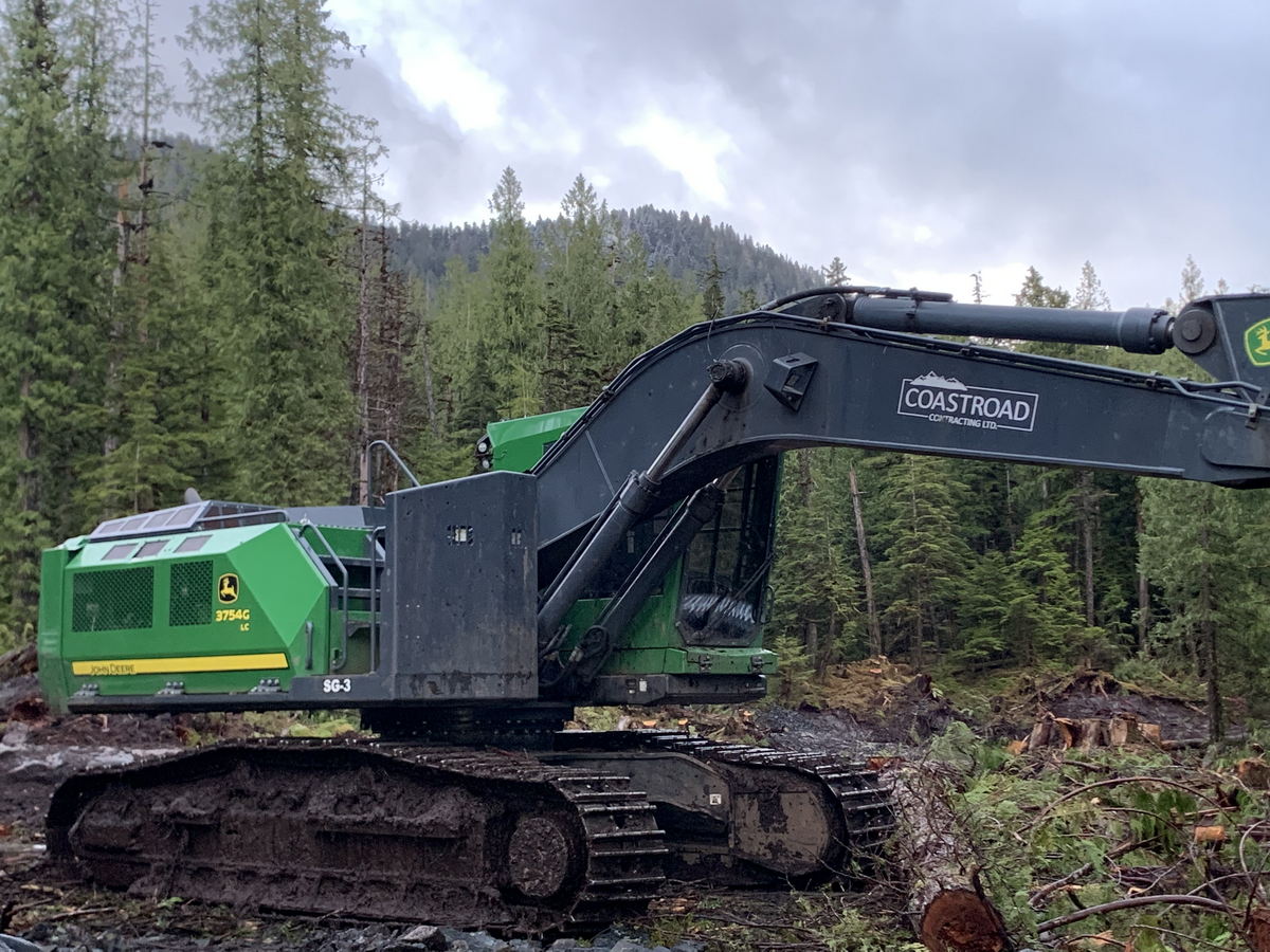 coastroad-construction-gallery-04 Excavator in forested construction site