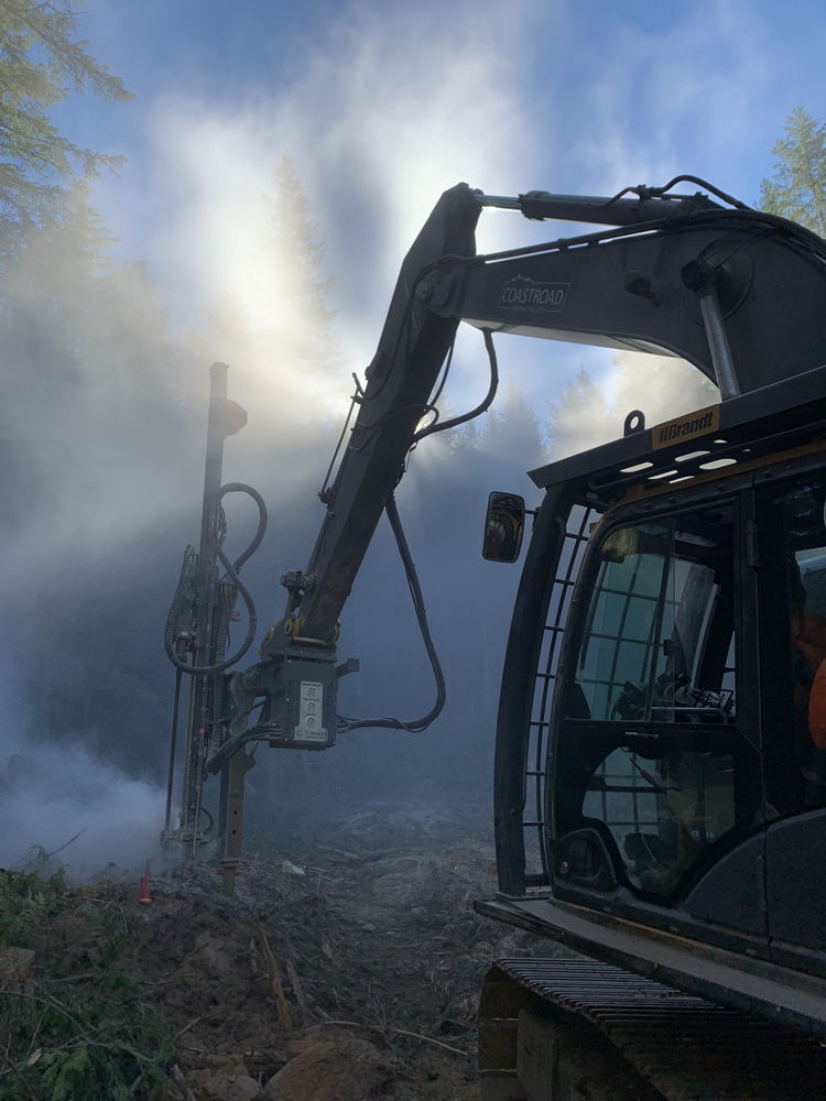 coastroad-construction-gallery-05 Excavator drilling in misty forest