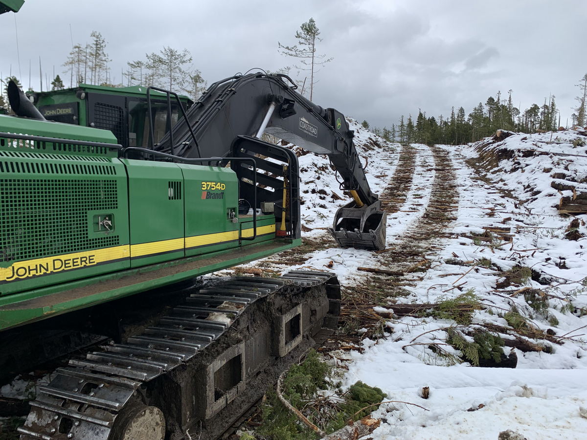 coastroad-construction-gallery-06 Excavator clearing snowy forest area